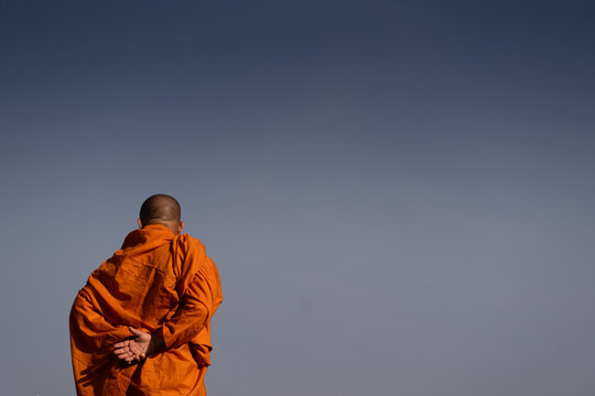 Buddhist monks with their colourful robes and shaved heads sometimes living with only necessary items