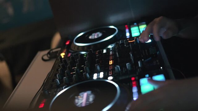 DJ Controller Mixer Closeup View of Hands Play Buttons at Night Event Music Performance