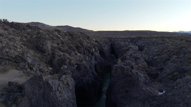 Argentina Mendoza Aerial Drone Slow Landscape of Volcanic Canyon River at La Payunia Reserve