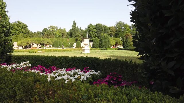 Slow Pan of Retiro Park Parterre Garden Madrid Spain Flower Beds Landscape and Topiary Trees
