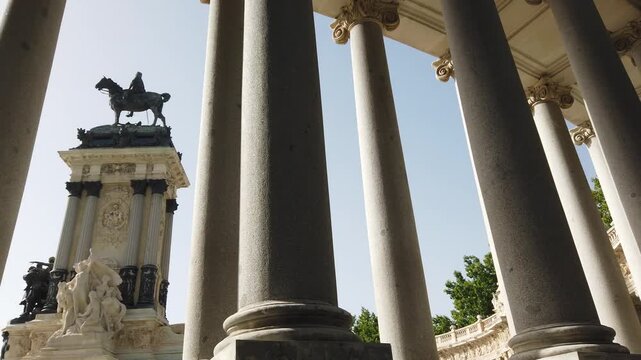 Low Angle Pan of Retiro Park Alfonso XII Monument Columns Madrid Spain and Equestrian Statue