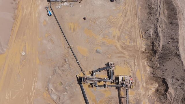 Heavy Industrial Mining Equipment With Rock Drilling Rig Operating In Active Quarry Near Caledon Village, Ontario, Canada. Aerial Topdown Shot
