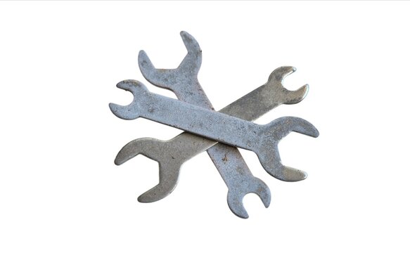 Three Old Rusty Crossed Open Ended Wrenches Isolated on White Background