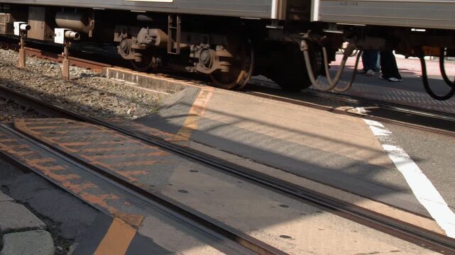 Commuter Train Passing Through Urban Level Crossing in Kyoto Japan