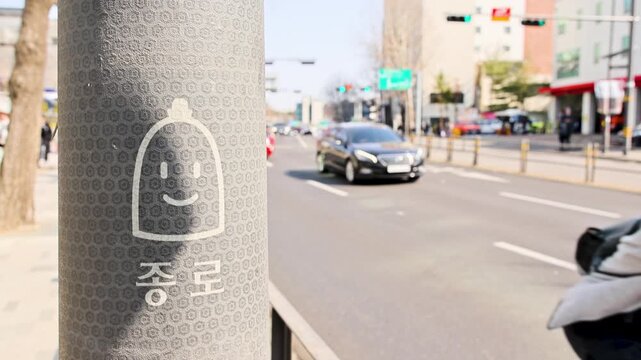 Seoul Jongno Street Marker With Cars And Scooter 