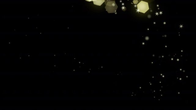 Golden bokeh particles create a magical night light trail of hexagonal sparkles.