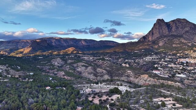 Foothill Town At Dusk With Rugged Peaks And Winding Roads, Soft Purple And Gold Light Across Slopes, Mixed