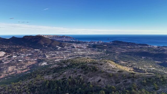 Coastal Horizon From High Ridge Showing Distant City Skyline And Ocean, Wide Blue Sky, Scrubby Hillside