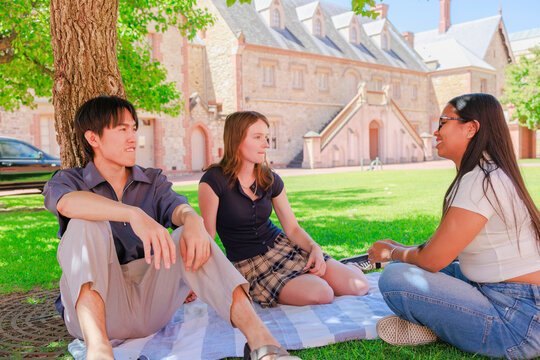 Young Students Relaxing and Chatting During Break Time