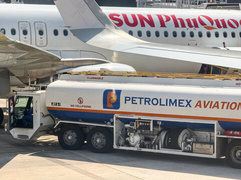 Ho Chi Minh City, Vietnam - March 10, 2026: Petrolimex Aviation Fuel Tanker Refueling Sun PhuQuoc Aircraft at Tan Son Nhat