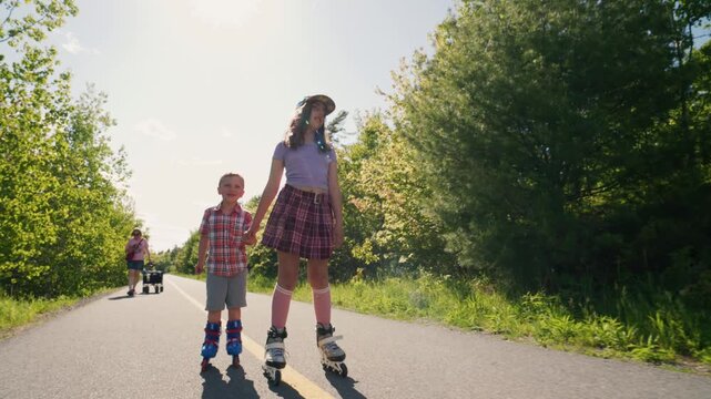 Children enjoy a sunny day skating down a vibrant path. Laughter fills the air as they hold hands, making lasting memories under the warm sun.