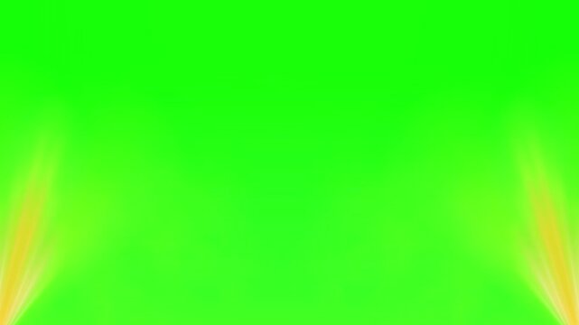 Warm stage spotlights shining from the bottom corners on green screen background