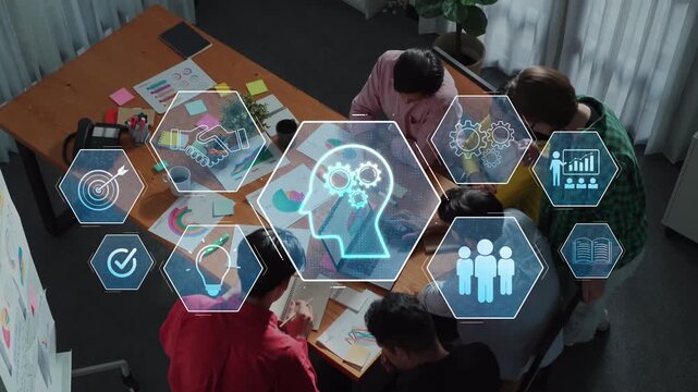 A dynamic team engages in brainstorming and planning, surrounded by visual aids and technology, emphasizing collaboration and innovative thinking in a modern office setting. Raster