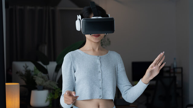 Asian Woman Playing VR Games at Home