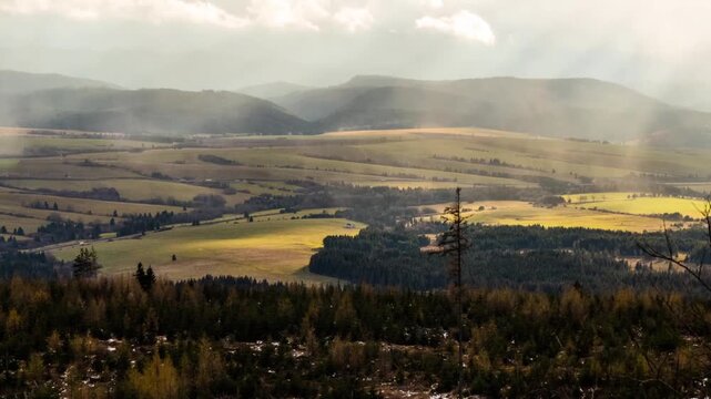 Beautiful valleys in Slovakia near the High Tatras. The rays of the sun are falling on the surface of the earth through the floating clouds.