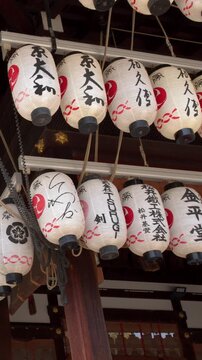 Rows of Traditional Japanese Paper Lanterns at Kyoto Shinto Shrine