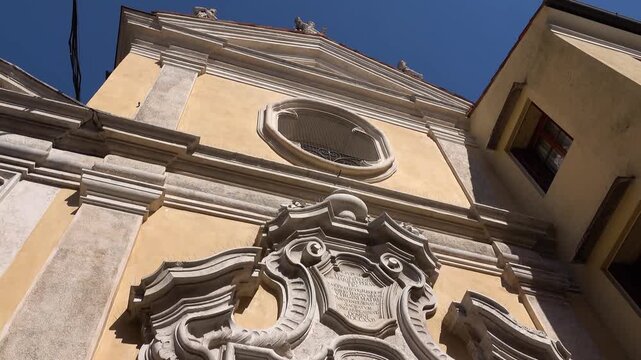 Facade of a building with ornate carvings on it. Bassano del Grappa, Vicenza province, Veneto, northern Italy.