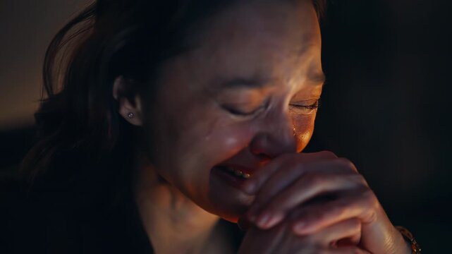 Closeup crying business loser feeling sad at evening office. Upset businesswoman