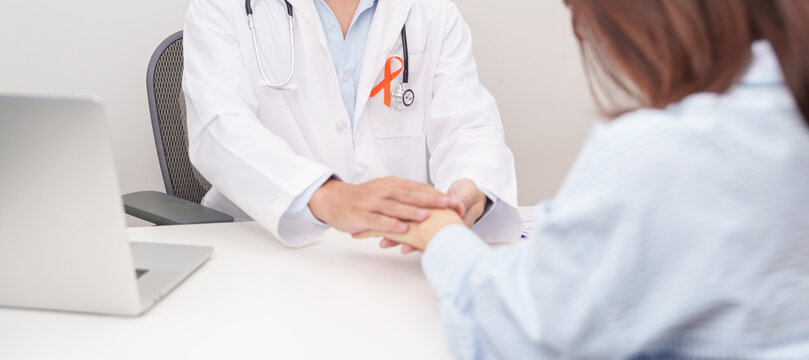 professional doctor holding patient hand to comfort for February World Cancer Day, September Leukemia, March Kidney, August Appendix, MS, Self Injury, November CRPS and COPD disease concept