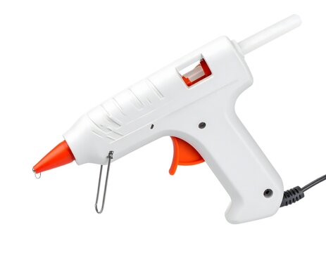 White electric hot glue gun with an orange trigger and nozzle isolated on a pure white background. Craft tool.