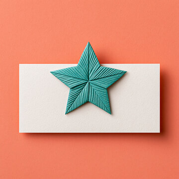 Turquoise Origami Star on Coral Paper Background with Copy Space