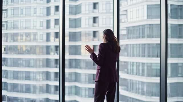 Office professional calling smartphone looking panoramic window grey workplace