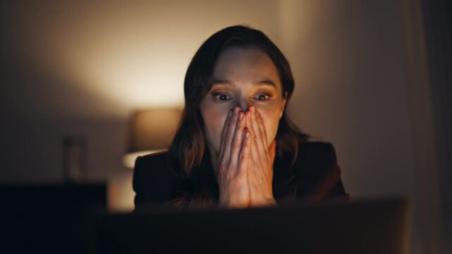 Amazed startuper shouting happy receiving great news on laptop in office closeup