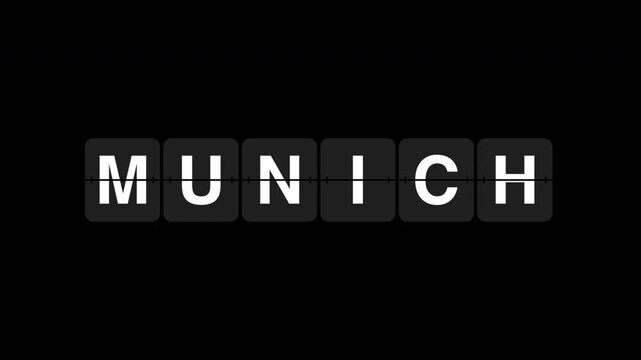 Munich word displaying on airport board, black green and white background