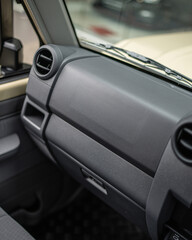 Obraz premium Close up car dashboard console interior with vents and controls.