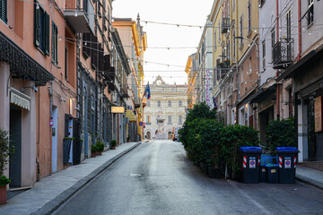 Fototapeta premium Street view perspective leading to Piazza d'Italia and Palazzo della Provincia in Sassari, Sardinia, Italy