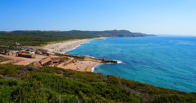 Panoramic view of Fontanamare sand beach and old mining ruins in Gonnesa, Sardinia, Italy