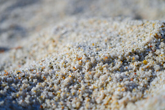 Macro texture of quartz sand grains on Is Arutas beach in Cabras, Sardinia, Italy