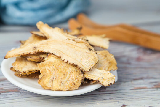 Dried Angelica Sinensis Slices on White Plate