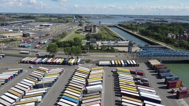 Drone shot frames the Port of Antwerp-Bruges building with canals and harbor access.
