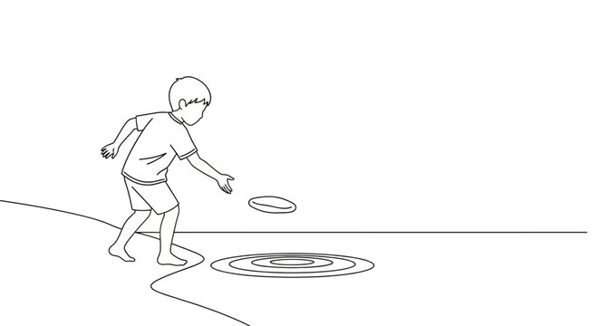 Child playing with frisbee on the ground.