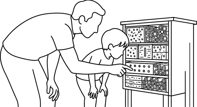 Father and son examining a beehive frame together.