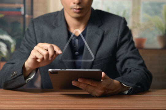 Businessman Using Tablet with Abstract Digital Triangle for Technology Concept
