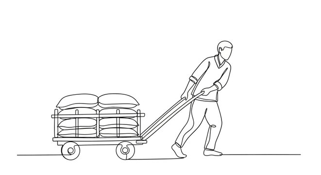 Man pulling cart with large sacks on flat surface.
