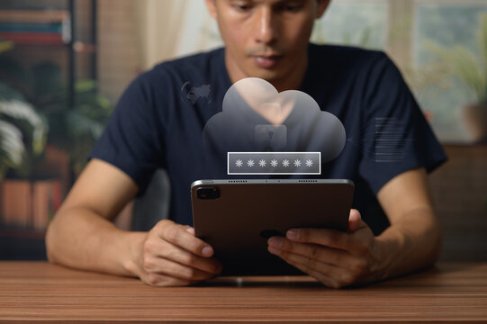 Young man using smartphone with cloud storage icon in modern indoor setting