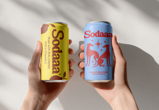 Hands Holding Colorful Soda Cans With Modern Beverage Branding