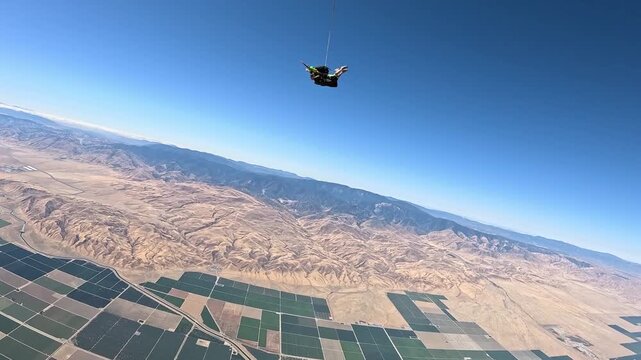 Skydiving. A tandem is falling through the sky.