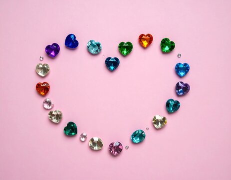 Colorful beaded bracelets with gemstones on pastel background.