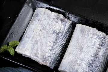 Fresh Frozen Wild Zhoushan Scallop Sections on Black Tray Studio Food Photography © KieuThi