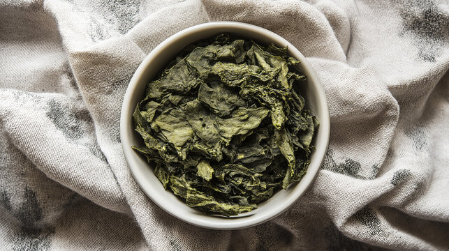 comfrey. Fresh green herbal paste on a linen cloth, a natural remedy prepared. lifestyle magazines, social media lookbooks, designed for influencer and brand collaborations.