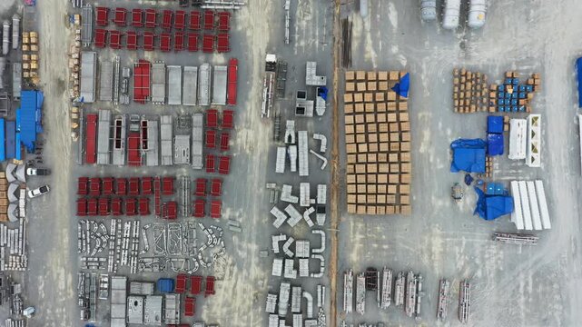 Large warehouse storage displays stacked pallets of red blue shipping boxes against dark industrial background-ideal for logistics supply chain visuals inventory management.