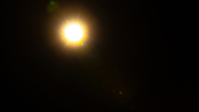 Sun flare on the black background
