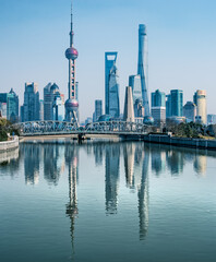 Shanghai Skyline with Oriental Pearl Tower and Modern Architecture Reflected in River © CaoVan