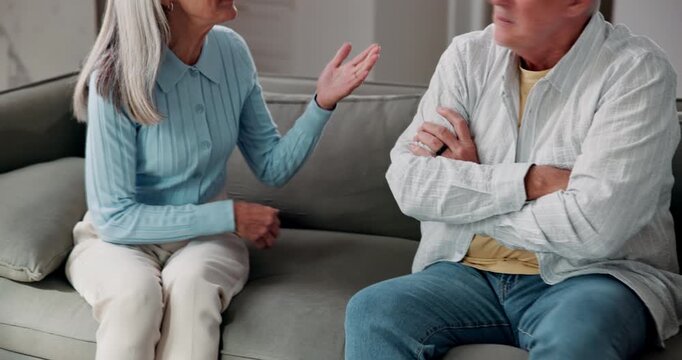 Conflict, fighting and hands with couple on sofa in home for argument or disagreement. Anger, relationship and stress with mature people in apartment for blame, frustration or marriage mistake