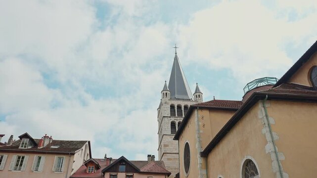 Historic Church Bell Tower in Annecy Old Town Under Cloudy Sky.Filmed on April 29, 2026.