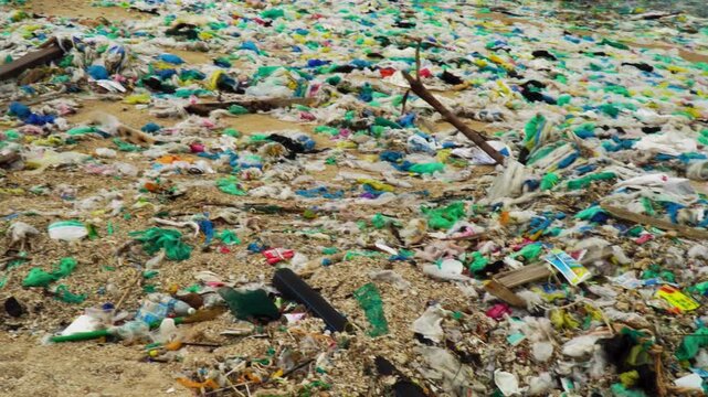 Disturbing scenes of Plastic bottle on a sandy beach . Environmental pollution concept, marine debris, plastic waste, ocean conservation, coastal cleanup, ecological problem, nature